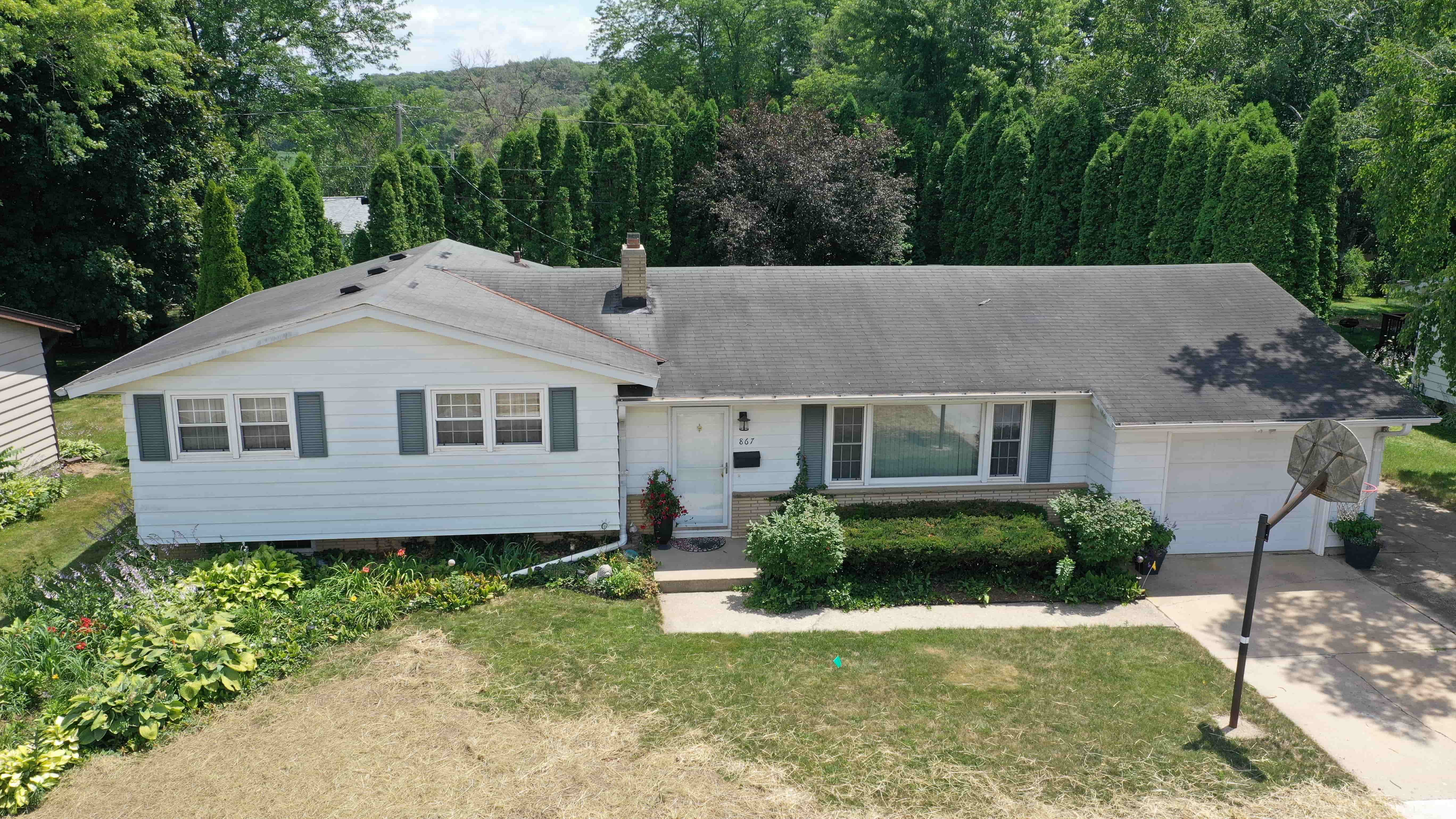 Before roof replacement showing worn and aging asphalt shingles with visible wear and reduced performance