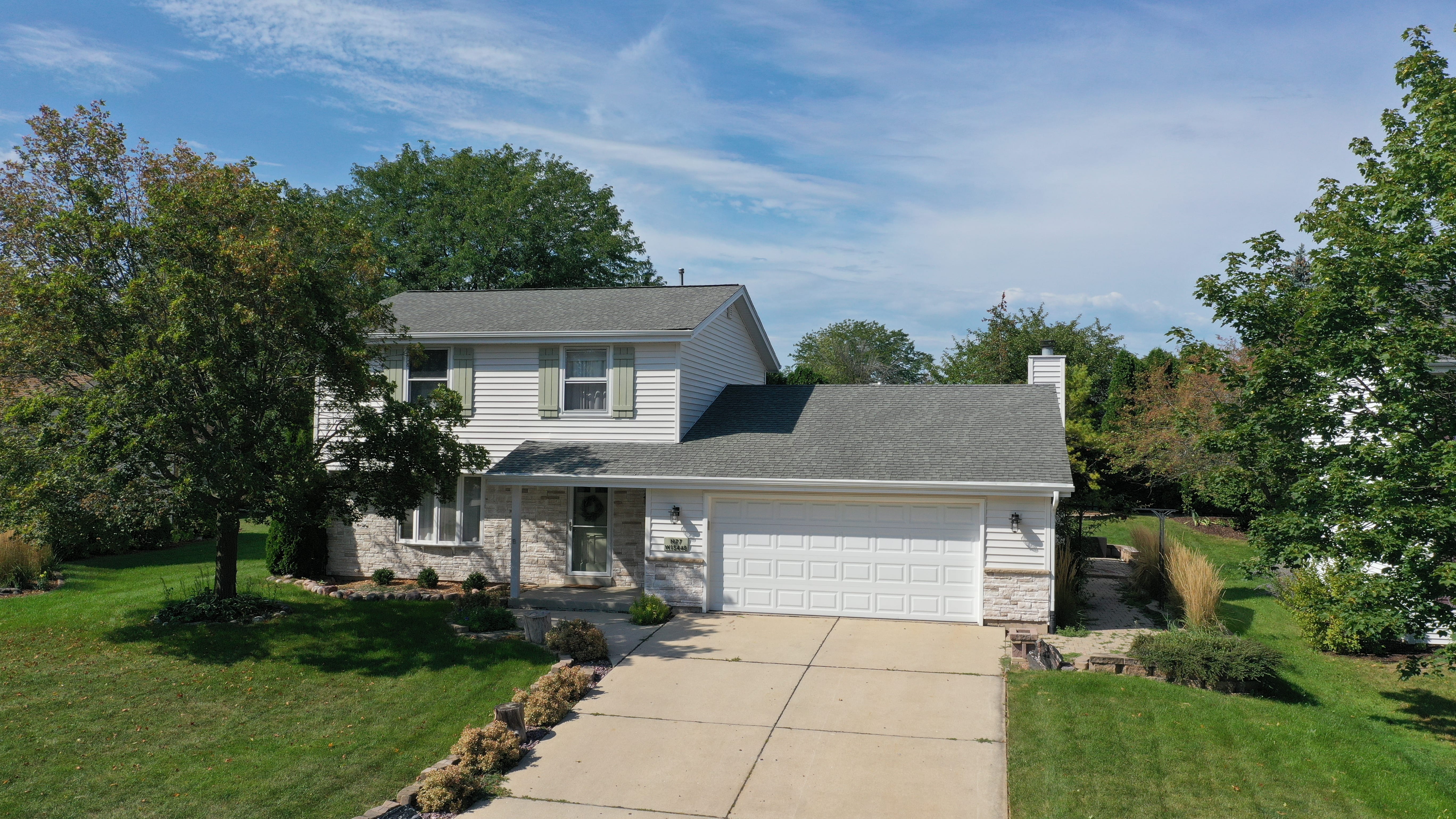 After siding and gutter upgrade in Milwaukee WI with new Mastic vinyl siding and seamless gutters by Ridge Top Exteriors
