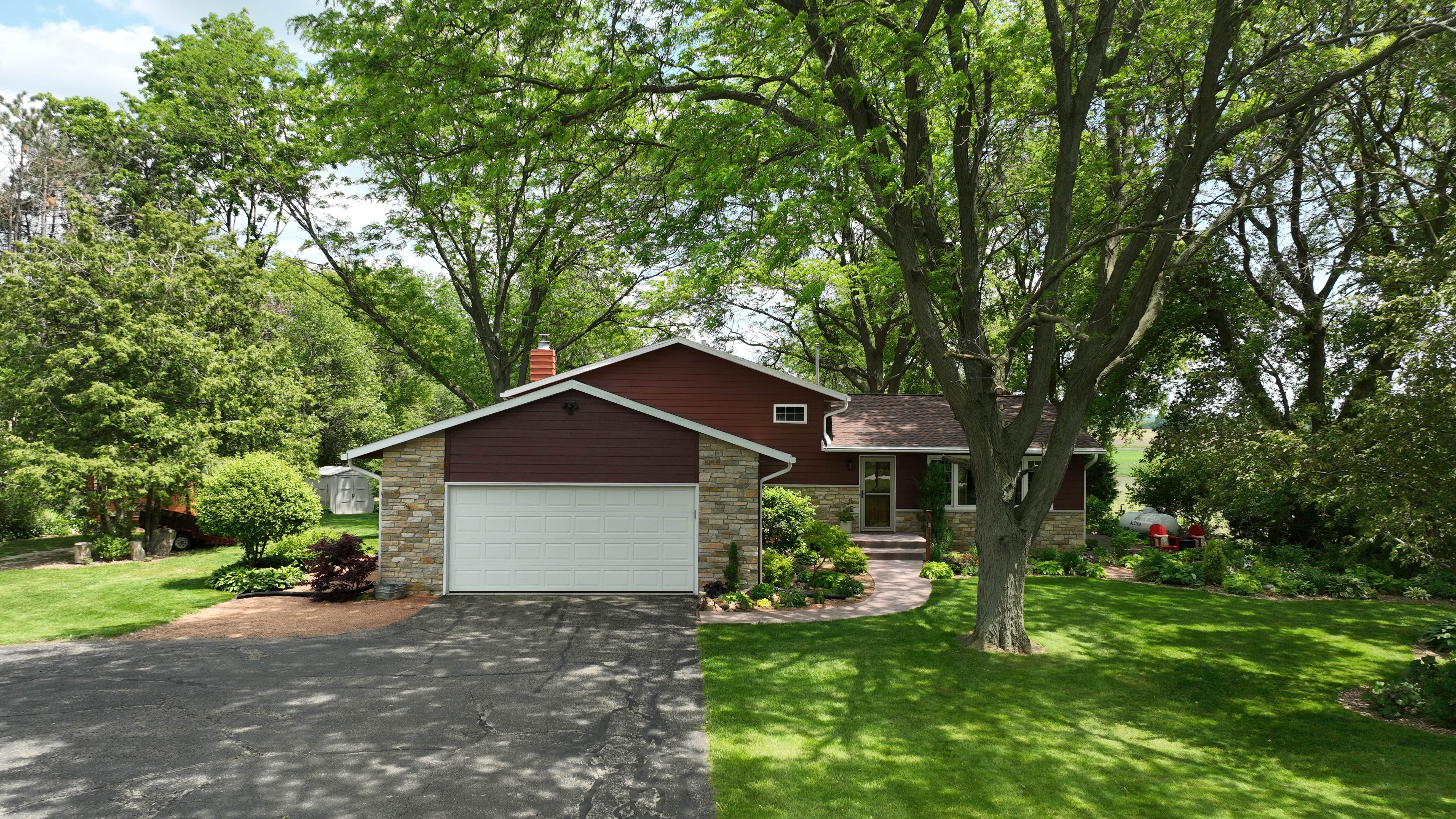 Madison WI roof and siding transformation by Ridge Top Exteriors featuring GAF Hickory shingles and LP SmartSide siding in Redwood